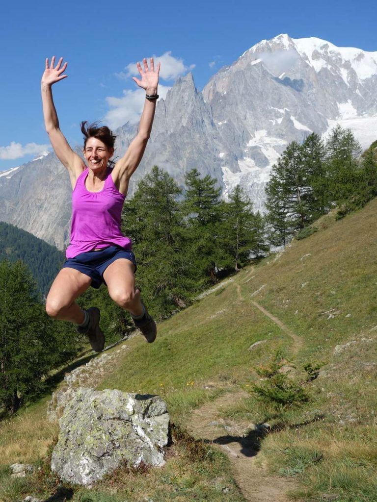 Lady jumping in the air on the Tour du Mont Blanc